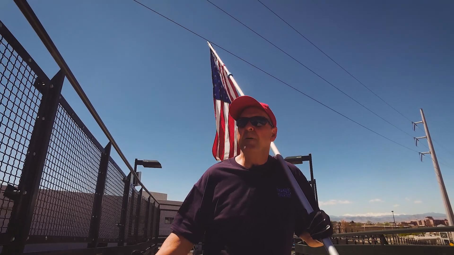 Meet 'the flag guy' you've seen waving his American flag over highways around Denver